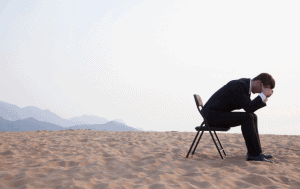 young man upset on the beach as he battling co-occurring disorders and seeks treatment from Chicago rehab Center